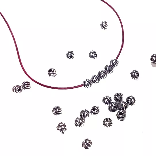 Perles de 6mm avec motif trou 1.10mm