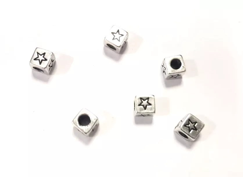 Intercalaire traversant cube avec motif étoile