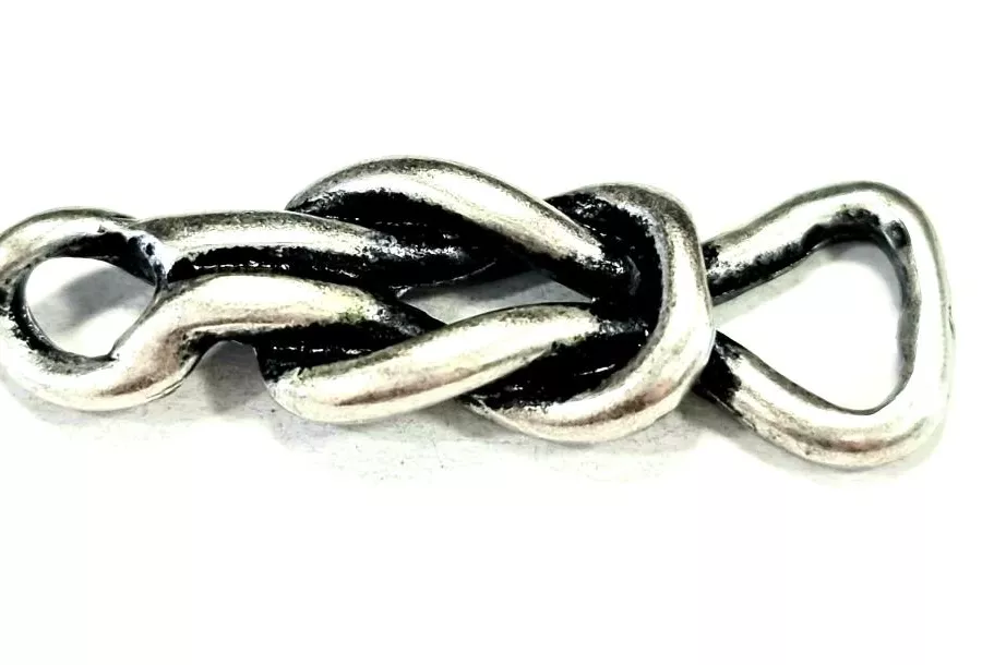 Intercalaire forme noeud coulissant